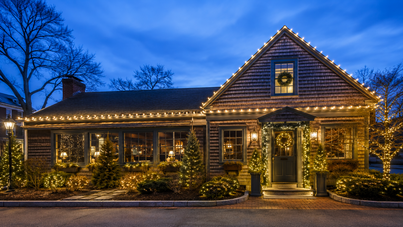 Cape-style business property decorated with professional Christmas lights
